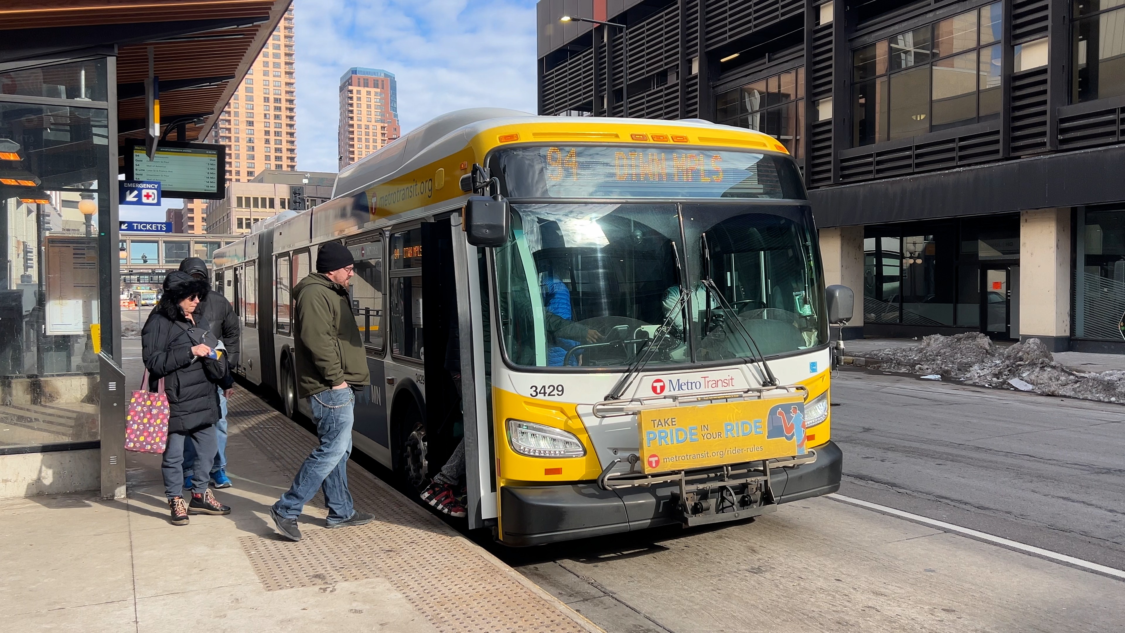 Passengers board a Route 94 bus in St Paul.